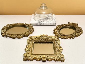 Photo Frames And A Cheese Serving Marble Slab And Glass Cloche