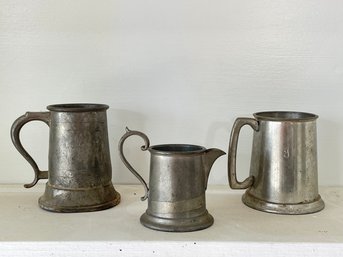 A Trio Of Antique Pewter Mugs