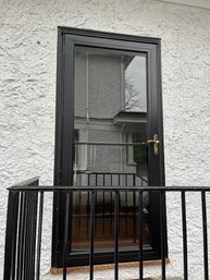 An Andersen Aluminum Storm Door With Retractable Screen - Guest House - Front