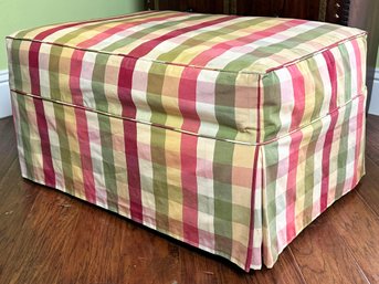 An Upholstered Ottoman In Piped Preppy Check