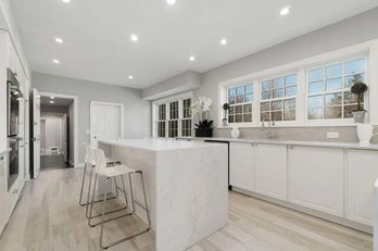 An L Shaped Base Cabinet Set With Marble Counter - Waterfall Edges - RH Hardware