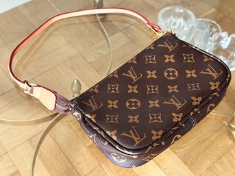 A Ladies Purse By Louis Vuitton