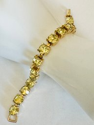 WELL MADE PRETTY GOLD TONE AND YELLOW RHINESTONE BRACELET