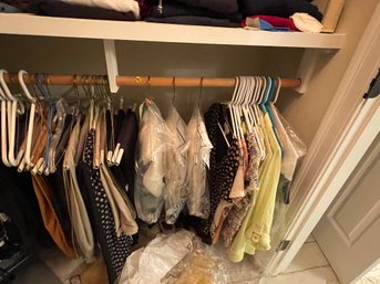 LARGE RACK OF WOMENS TOPS, MENS AND WOMENS SLACKS AND PANTS