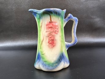 A Vintage Faience Pitcher In Vibrant Tones