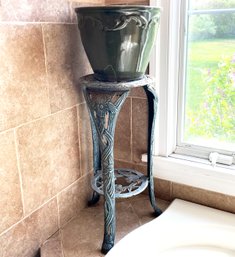 A Metal Plant Stand And Glazed Earthenware Planter