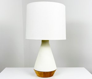 A Modern Table Lamp With Wood Base