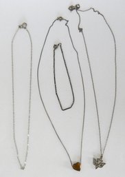 A Grouping Of 3 Sterling Silver Necklaces With A Bracelet