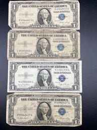 Four 1935 Blue Seal 1 Dollar Bills.