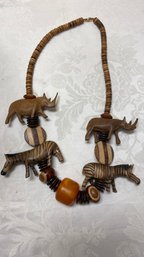 A Vintage Carved Rhino Rhinoceros Zebra Wood Necklace