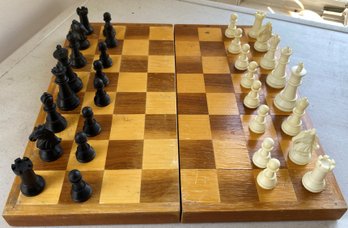 A Vintage Cast Plastic Chess Set With Chess Board