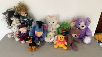 A Group Of Stuffed Animal Toys & Doll