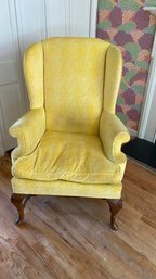 An Antique Yellow Upholstered Wing Chair