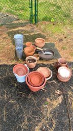A Group Of Gardening Essential Pots, Trays And More.