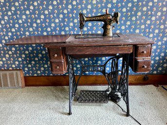 Antique Singer Sewing Machine On A Cast Iron Base.