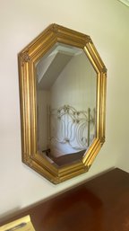 An Octagonal Gold Beveled Glass Mirror
