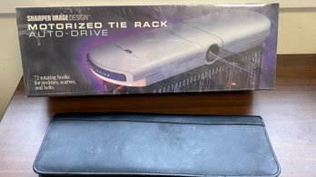 A Sharp Image Motorize Tie Rack & Leather Tie Travel Case By Coach