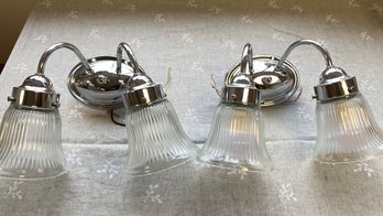A Pair Of Glass And Brushed Steel Electric Wall Sconces