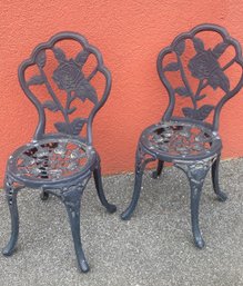 A Pair Of Cast Aluminum Bistro Chairs