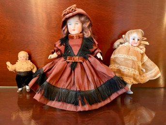 Three Antique Porcelain Dolls.