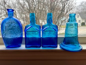 Four Blue Decorative Bottles.