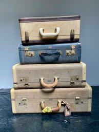 Four Vintage Suitcases