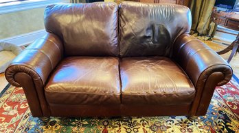 A Two Cushions Leather Couch By Harden