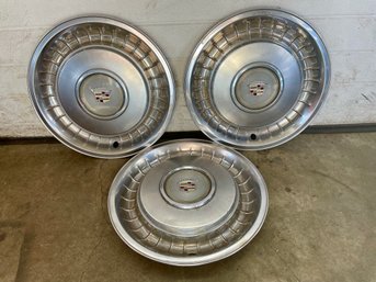 Three  Cadillac Wheels Hubcaps.(6)