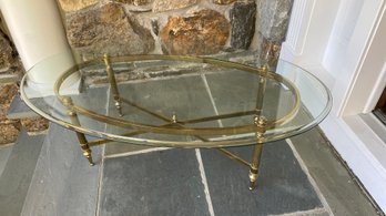 A Beautiful Oval Glass And Brass Cocktail Table - 50'w X 28'd X 16'h