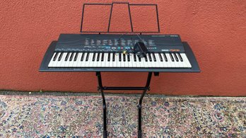 A YAMAHA PSR-18 Keyboard Piano  With Stand