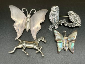 Four Sterling Silver Pins.