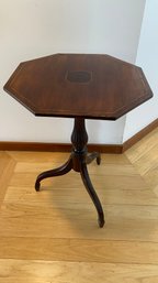 An Antique Tilt Top Candle Stand With Inlay Details.