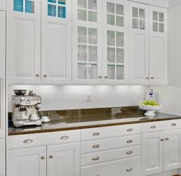 A Group Of White Kitchen Cabinets With Granite Counter - Uppers And Lowers