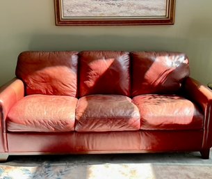 A  Red Faux Leather Sofa