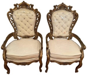 Pair Of Vintage Gilt Carved Wood Tufted Back Upholstered Arm Chairs With Plastic Covering