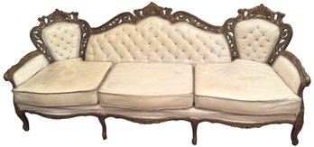 Vintage Gilt Carved Wood Tufted Back Upholstered Sofa With Plastic Covering