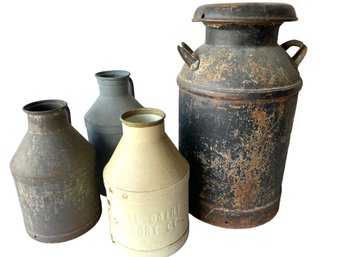 Four Vintage Metal Milk Cans.