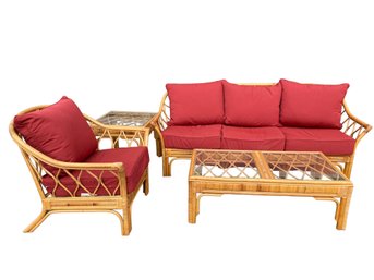 Four Piece Rattan Patio Set With Sunbrella Cushions And Glass Top Tables.