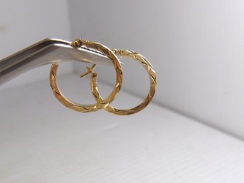 Pair Of Small 14K Yellow Gold Hoop Earrings - Engraved Design