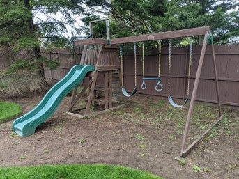 Wood Swing Set With A Slide And Picnic Table