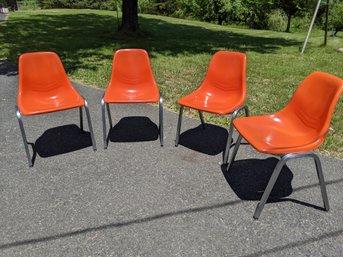 Set Of Four Orange Fiberglass Shell Chairs By Howell