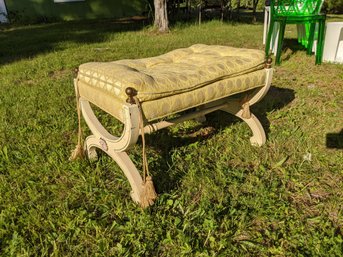 Upholstered Bench With Yellow Fabric On A Off White Base With Brass Finials