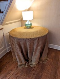 Round Table With A Custom Table Cloth