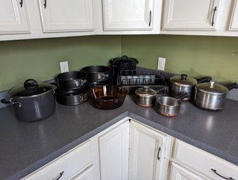 Collection Of 12 Cookware Pieces Including Pots And Pans