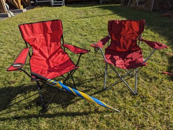 Two Traveling Folding Chairs And A Large Umbrella