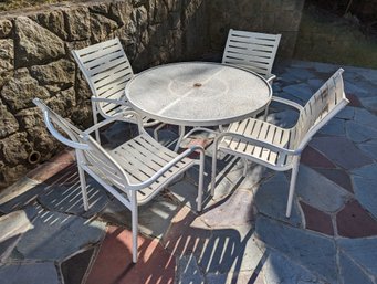 White Patio Set With Four Chairs And A Table By Tropitone