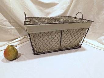 Lidded Cloth Lined Wire Basket With A Light Green Fabric