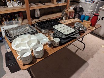 Table Of Kitchen Related Items Including Baking Pans And A Large Roasting Pan