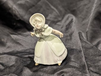 Porcelain Female Figure In A Lavender Dress With A Green Coat #4