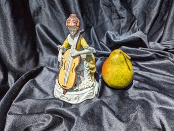 Porcelain Sitting Woman Playing A String Instrument Figurine